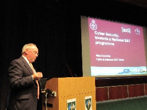 Mike Corcoran, acting head of the Ministry of Defense Cyber and Influence Science and Technology Centre, addresses the chapter in June.